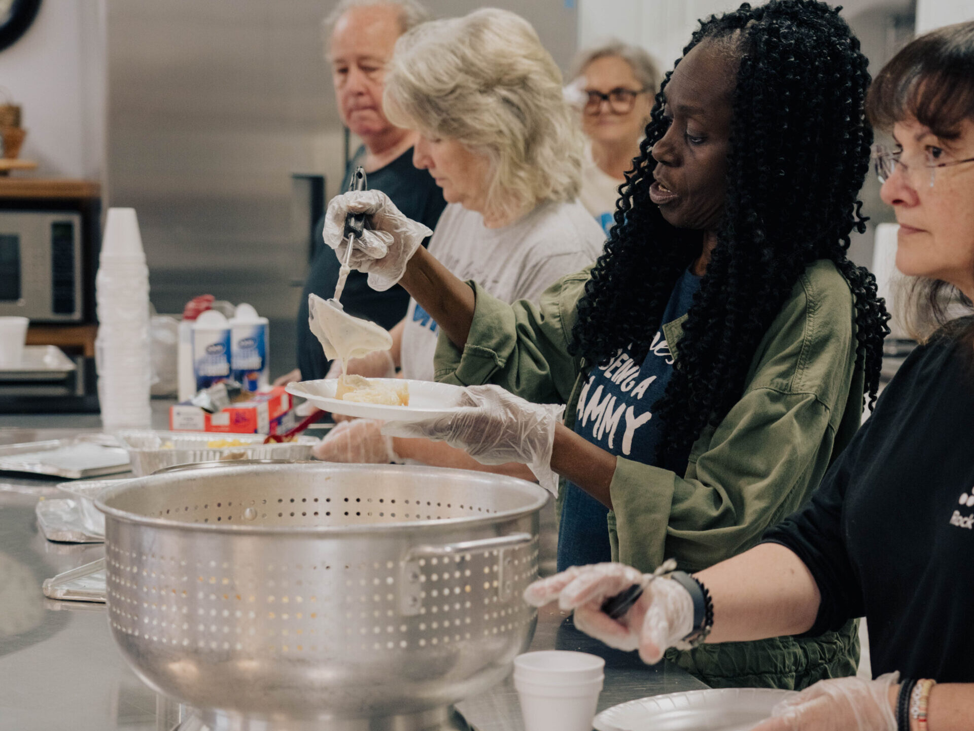 people making food in kitchen