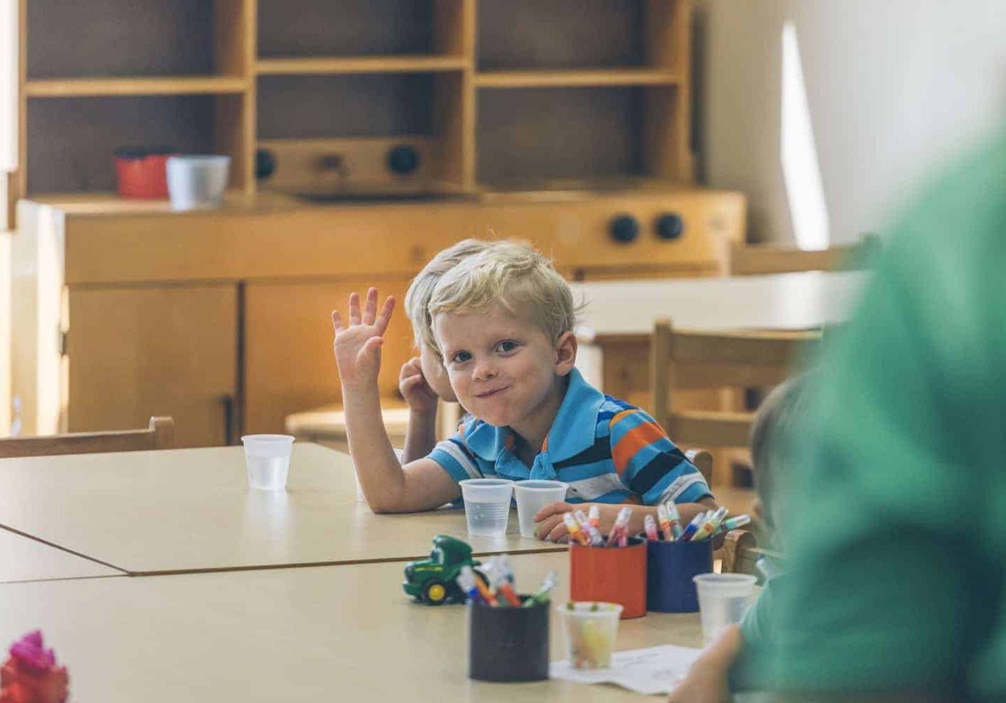 kid waving